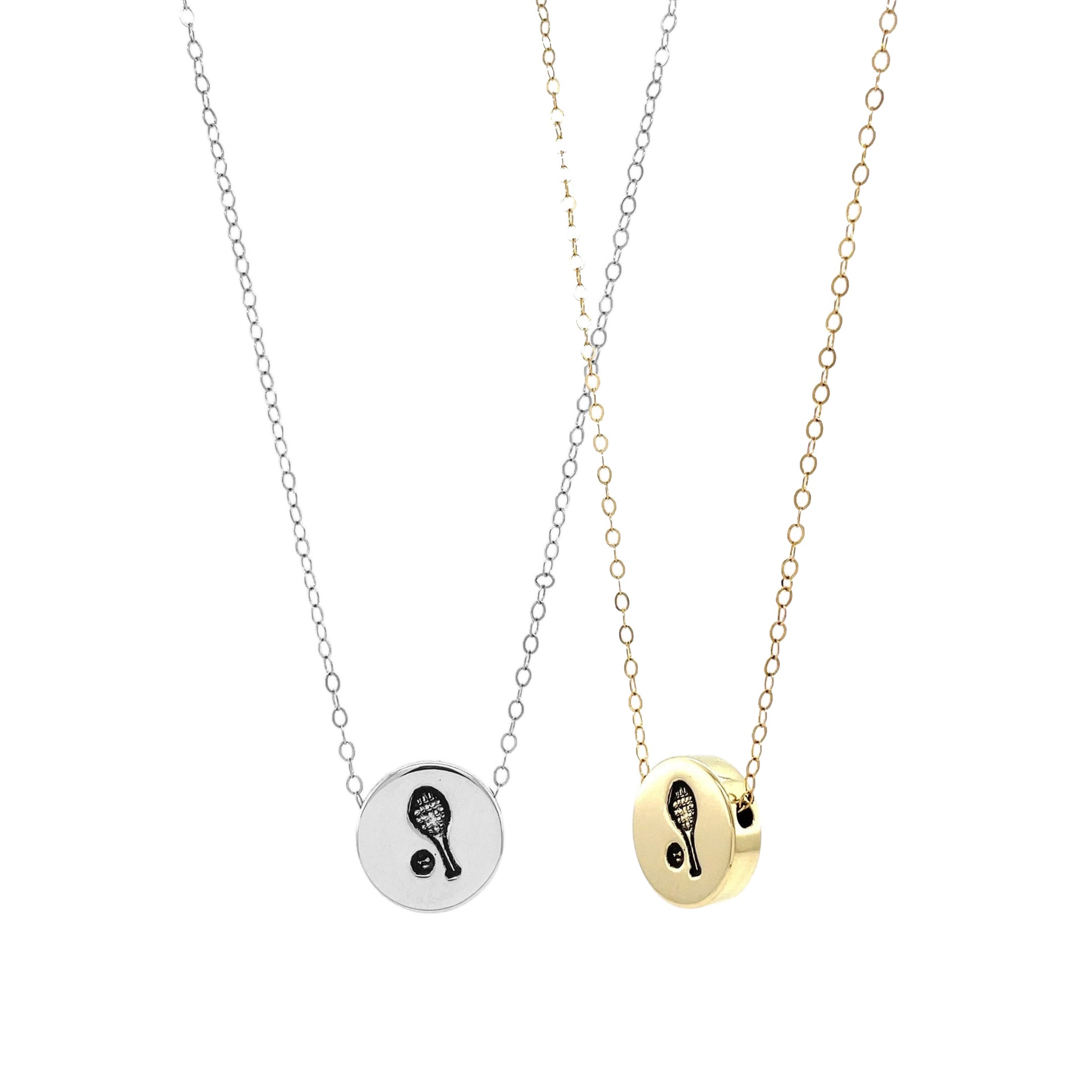 Two Tennis Racket and Ball Sliding Charm Necklaces side by side, showcasing the beautiful options in brass and sterling silver, perfect for layering or sharing with a fellow tennis lover.